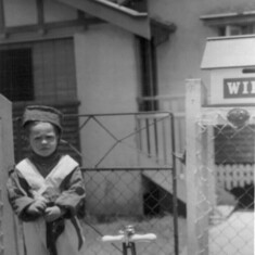 Major James Francis Truscott (aged 3 years) outside family home in Ashgrove Qld