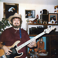 Jim with his guitar and Aussie hat