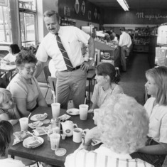 Jim Peck talks with customers at Long's Drug Store in 1985