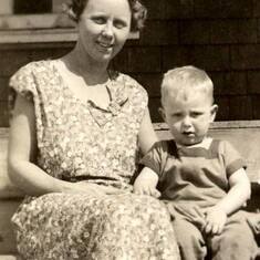 Jim with his mother on their porch steps