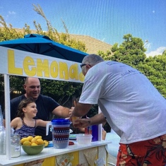 Assisting with Emma’s lemonade sales, she was so proud