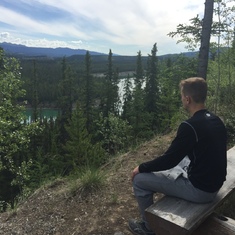 Photo of James taken by his mom, looking over the Yukon River.