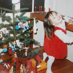 Baby Rachel celebrating one of her first Christmas mornings with Jimmy and Lynda.