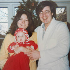 Jimmy, Lynda, and baby Rachel on Christmas morning, 1979.