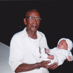 grand dad an his granddaughter jeremequia rodgers at 1 week old..