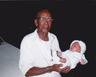 grand dad an his granddaughter jeremequia rodgers at 1 week old..