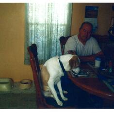 Dad and Dakota dining together. Dad taught Dakota to eat at the table.
