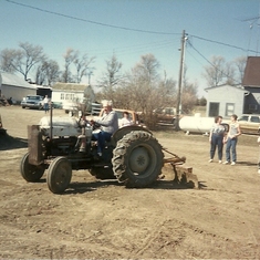 Dad blading the yard with his Ford tractor