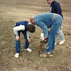 Dad with Grandsons-Scott & Ryan checking a new baby calf