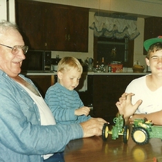 Dad playing tractors with his grandsons-Michael & Scott