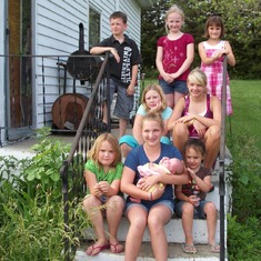 Some of the Great Grandkids on Grandpa & Grandma's front porch (2010) -Connor- Abbygale-Haley-Kaylee-Tabitha-Chloe-Taylor-Lauren-Adalyn