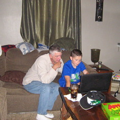Bailey showing Grandpa how to use the laptop. Early Sept, flood day