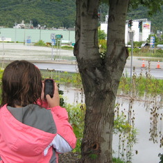 Maddi taking pictures of flooding