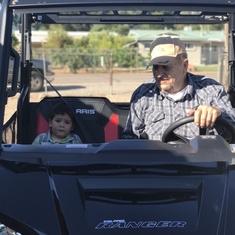 Grandpa giving Aiden a ride on his new Ranger