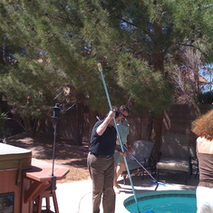 Jamie teaching me to clean my pool.