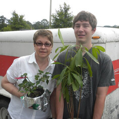 Grandma McPeak and Jared - unpacking Samantha's plants when she moved into her college dorm. Jared is holding a plant Sam had for a long time and she named it Giraffe.