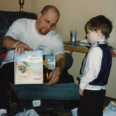 Uncle Tom Hoffman with Jared - helping open a present.