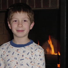 Christmas 2001 - Jared in front of the fireplace.