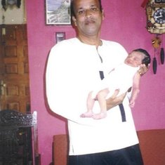 With his First Grandchild -  Marielou