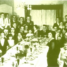 Jay as a a child at a Passover Seder (on his father's lap, far right)
