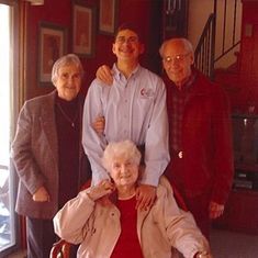 Chuck Solomon's photo of Eileen, Brandon, Dad  and Mom at Redwood Lane.  Note the loved grandfather clock on the stairs.
