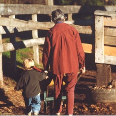 Jean and grandson, Dylan - in the corral 1997