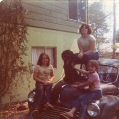 Sitting on Dad's Morris Minor with Mutthilde.  1977