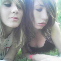 Laying in the grass.