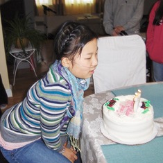 Jenny blowing out candles