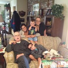Grandkids and grand dog visiting with Grandpa