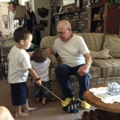 Papa playing with his Great Grandsons