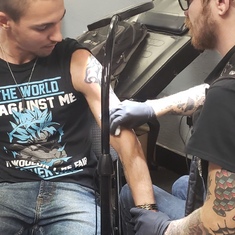 Derek getting Jesse's tattoo. 
