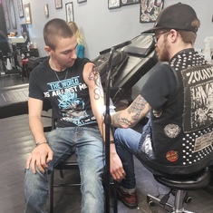 Derek getting Jesse's first tattoo.