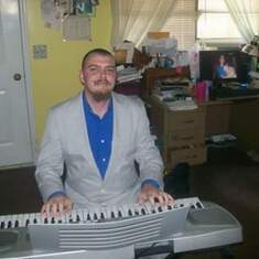 Jesse playing my keyboard. He loved playing the keyboard and the guitar
