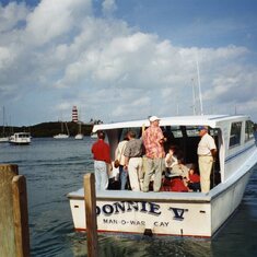 1996:  Cruise Director, Jim, on right, shepparding the group to Marsh Harbor.