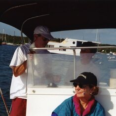 1996: Teaching JM how to operate the power boat.