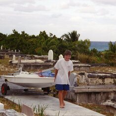1996:  Jim's son bringing home his Sunfish after sailing in the Hope Town Harbor.