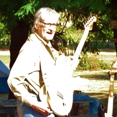 Jimi Lineham getting ready to play his guitar.
