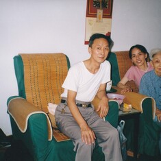 Jingqi with her parents, China 2002
