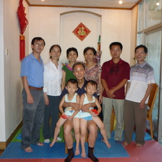 Jingqi (second from left, behind row) with her father, sisters, brother-in-law, nephews and grand-nephews, Jiangxi, China 2010