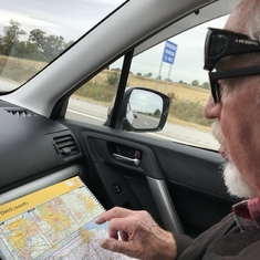 The man loved to travel and follow along with his atlas.