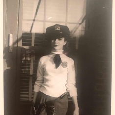 Joan wearing her father's police uniform