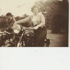 joan pushing the motorbike