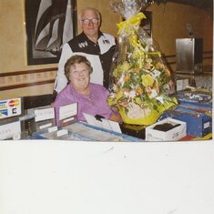 Joan and Dave receive flowers on the DJ record stand