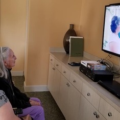 Mom with Rae watching Chris and Rae's wedding video. Mom wasn't able to make it to the wedding due to her health at that time (May 2015).