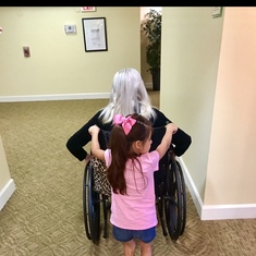 Aubriella pushing her great grandma around