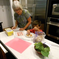Carter cooking with his Nona.