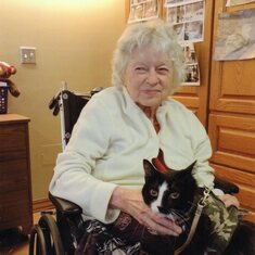 Joan at Madonna Towers with a therapy cat.