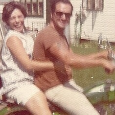 Mom and Dad on their motorcycle.