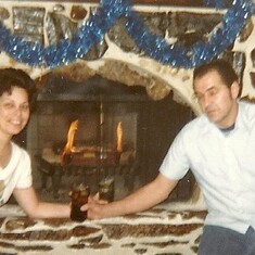 A holiday picture of Mom and Dad on Oakwood in St. Charles, Illinois. Dad made that fireplace. I remember waking up to him putting rocks in the wall. I thought he was going crazy. :)